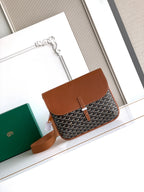 Goyard crossbody bag in brown with geometric pattern, top flap and shoulder strap.