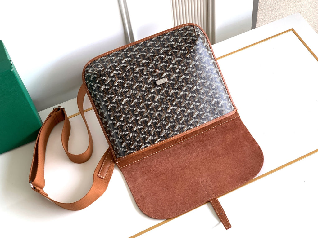Goyard small crossbody bag with patterned canvas, tan front panel, and shoulder strap.
