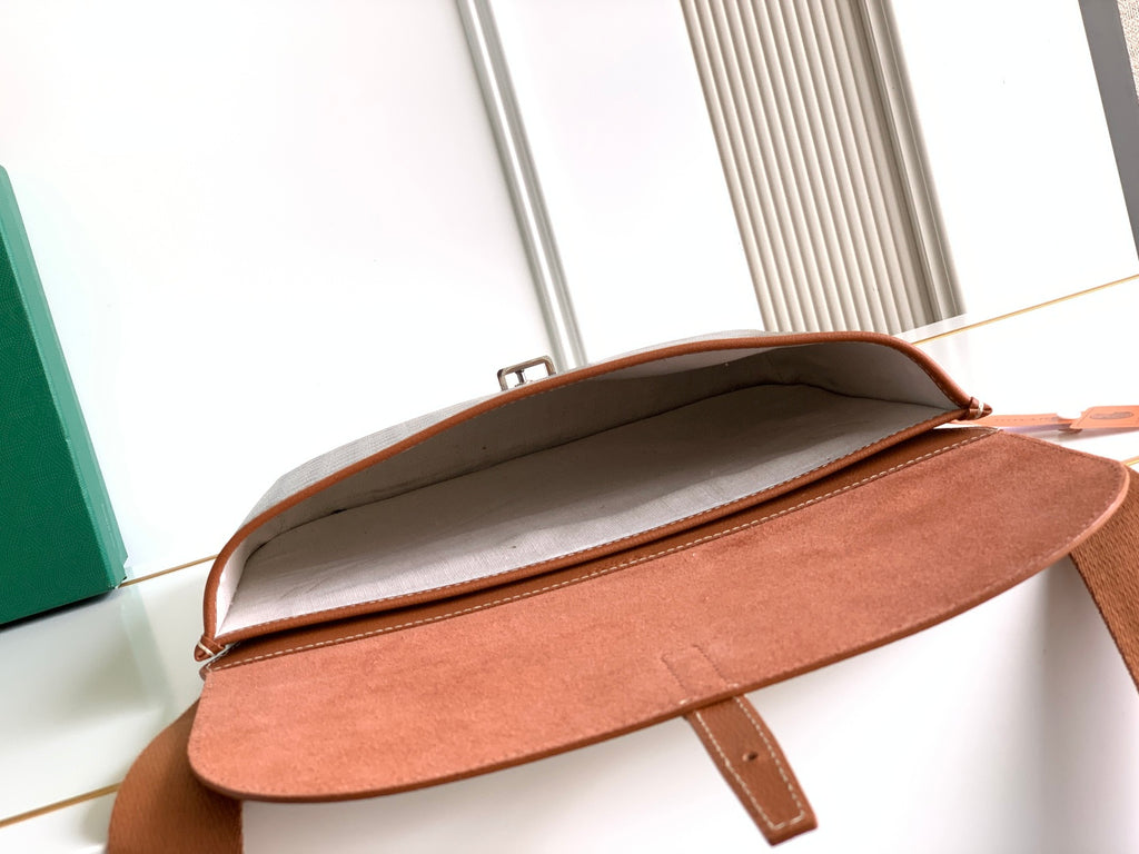 Goyard crossbody bag open top showing tan interior lining and front flap.