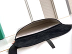 Goyard bag open flap view showing black suede-like lining and top edge