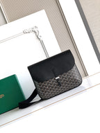 Goyard crossbody bag in black with geometric pattern, top flap and shoulder strap.