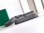 Goyard crossbody bag with long flap and dark gray shoulder strap