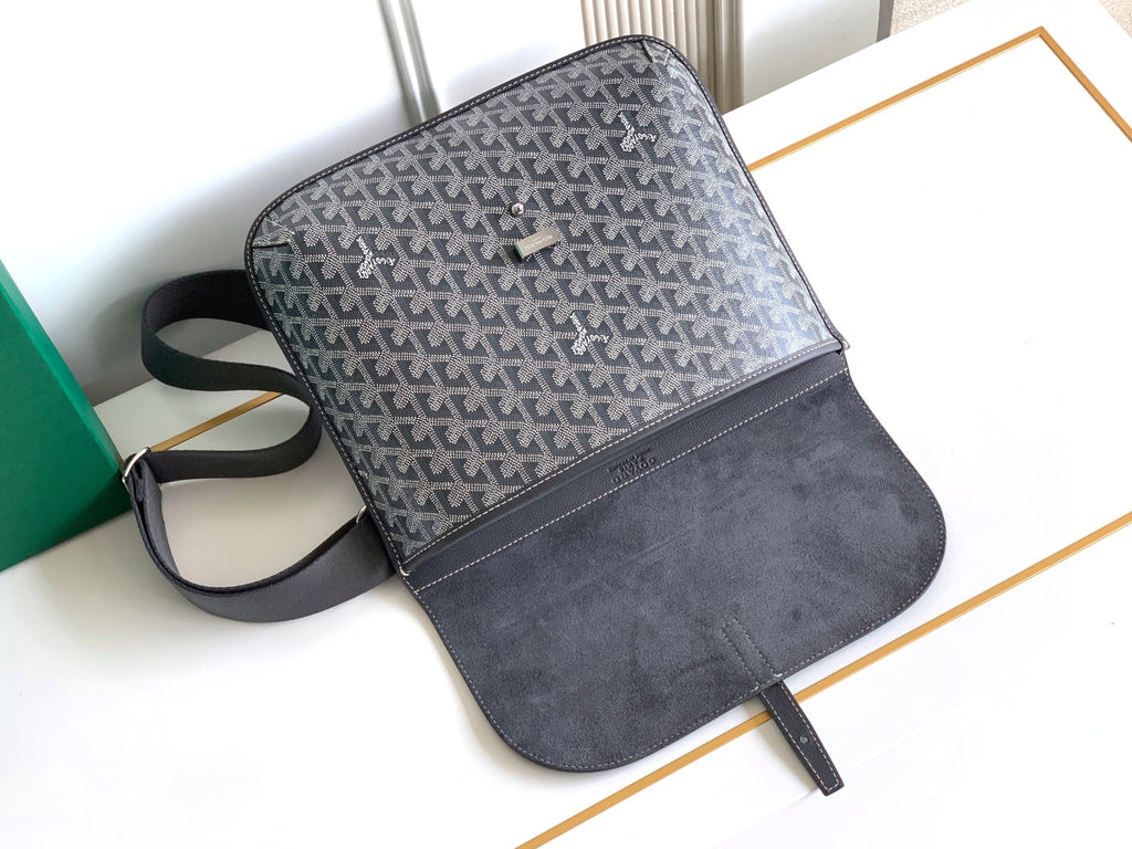 Goyard bag with gray patterned front, dark suede-style bottom, and strap