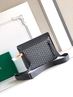 Goyard bag with structured gray body, dark flap, and shoulder strap