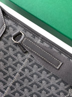 Goyard bag close-up of adjustable strap and top loop with metal hardware