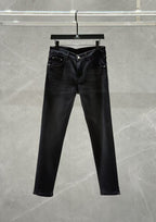 Dark denim jeans with zip fly, classic five-pocket styling, and straight legs.