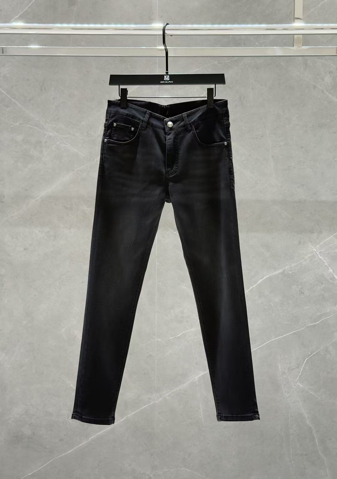 Dark denim jeans with zip fly, classic five-pocket styling, and straight legs.