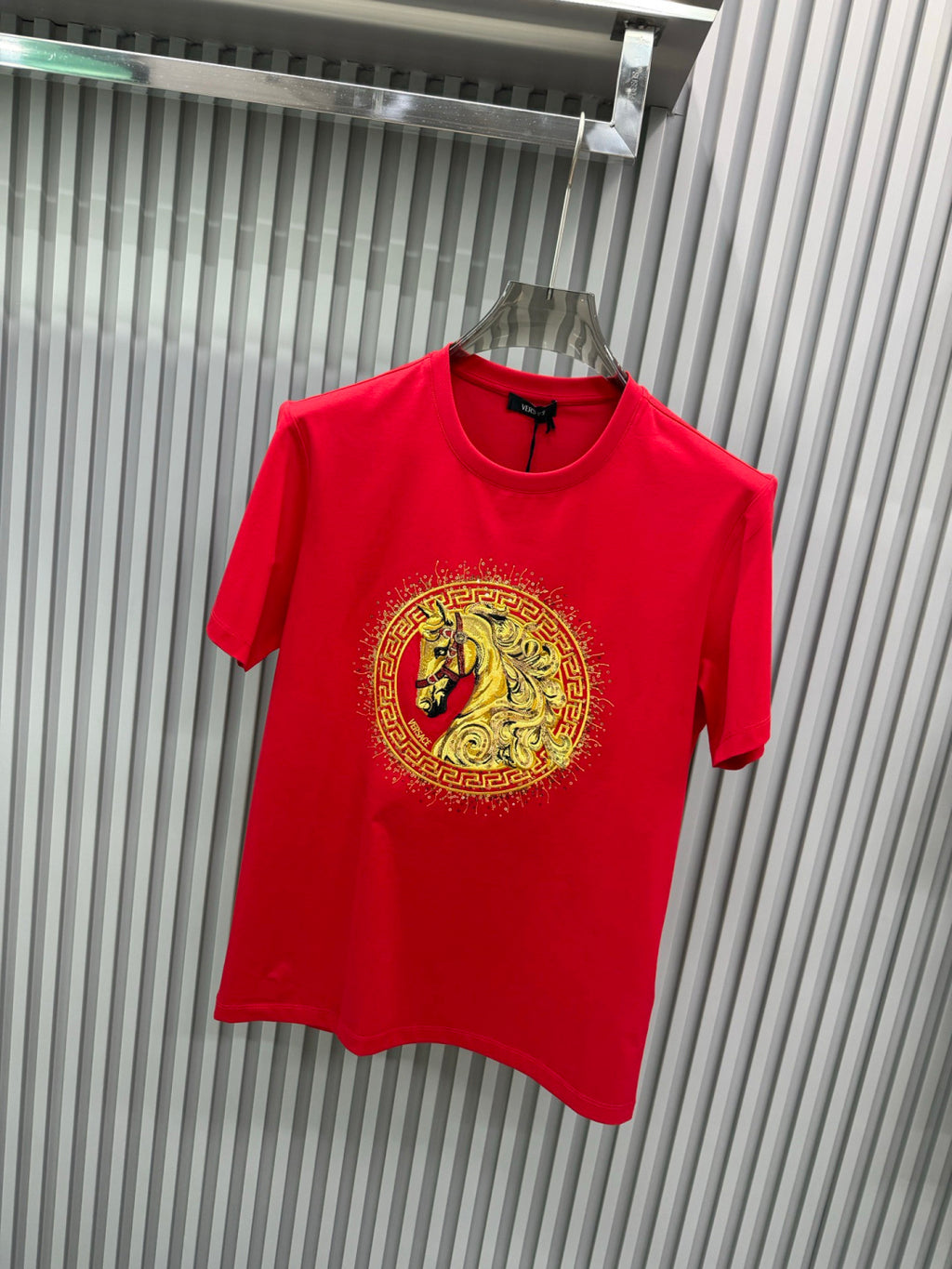 Versace red T-shirt on hanger, gold lion crest medallion, crew neck, short sleeves