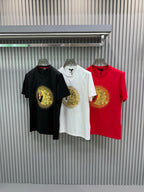 Three T-shirts: black, white, and red crew-necks with matching gold lion medallion prints