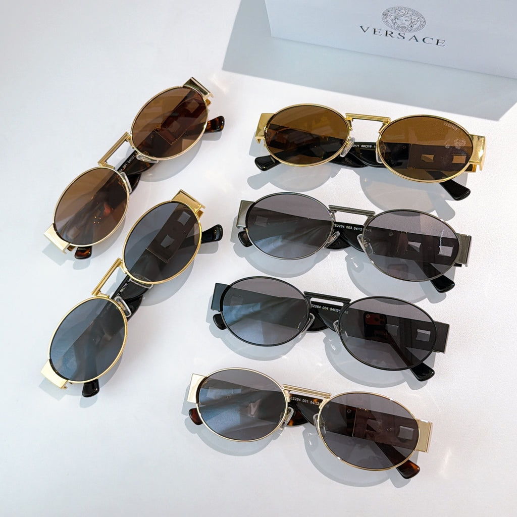 Versace sunglasses assortment, multiple round styles with dark lenses and gold accents
