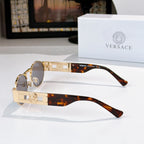 Versace sunglasses, gold-tone frames, round dark lenses, tortoiseshell temple tips