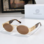 Versace sunglasses, gold-tone frames with tortoiseshell temple tips, brown lenses