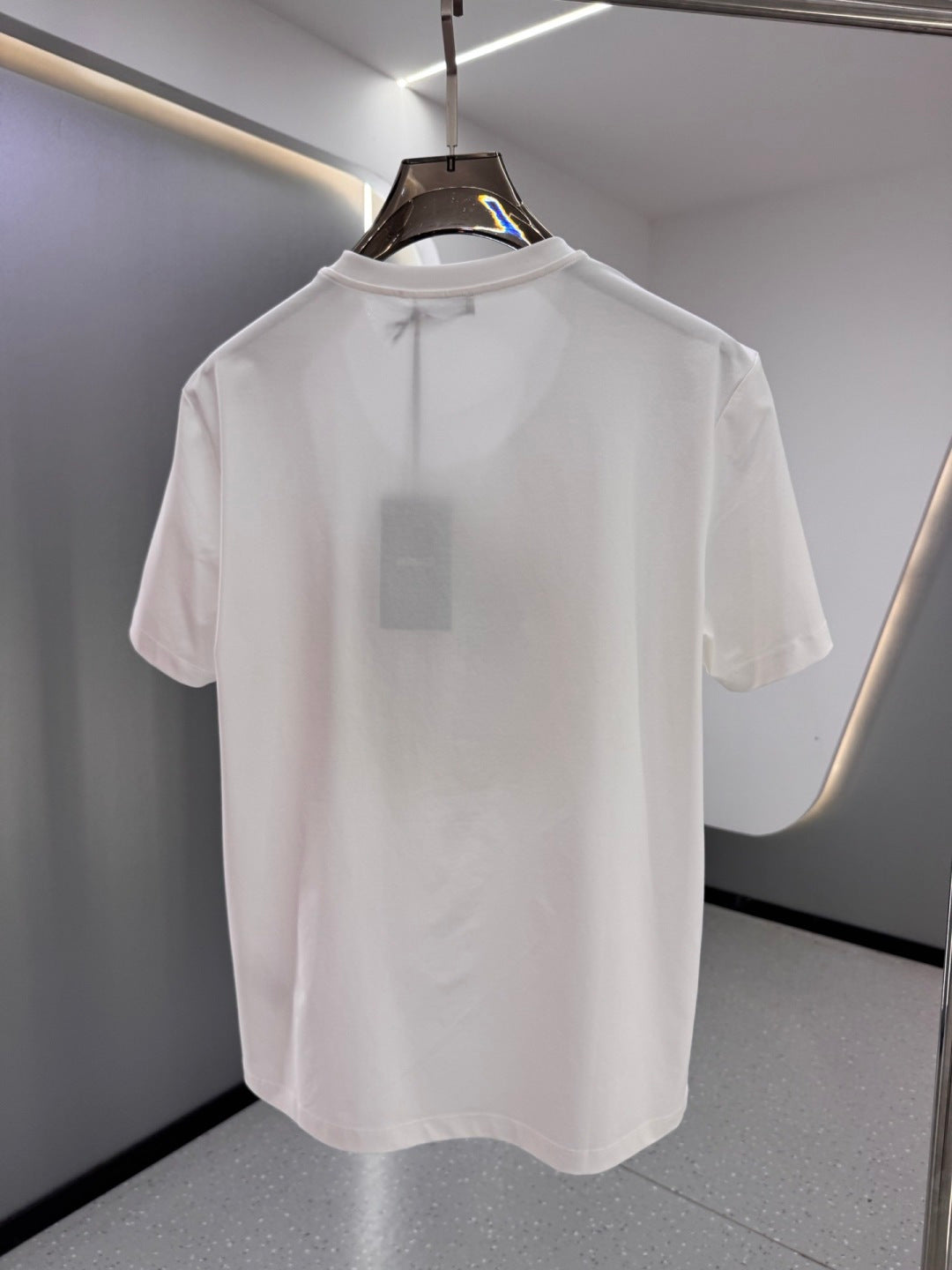 White crew-neck T-shirt, plain back with no visible graphic