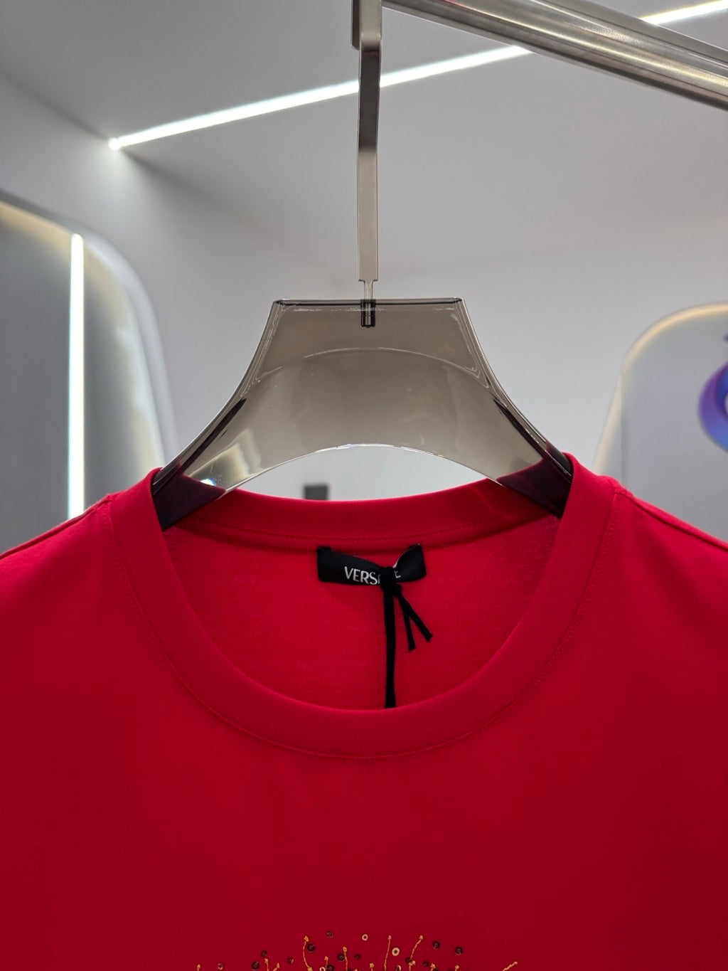 Versace red T-shirt neckline with black bow logo tag