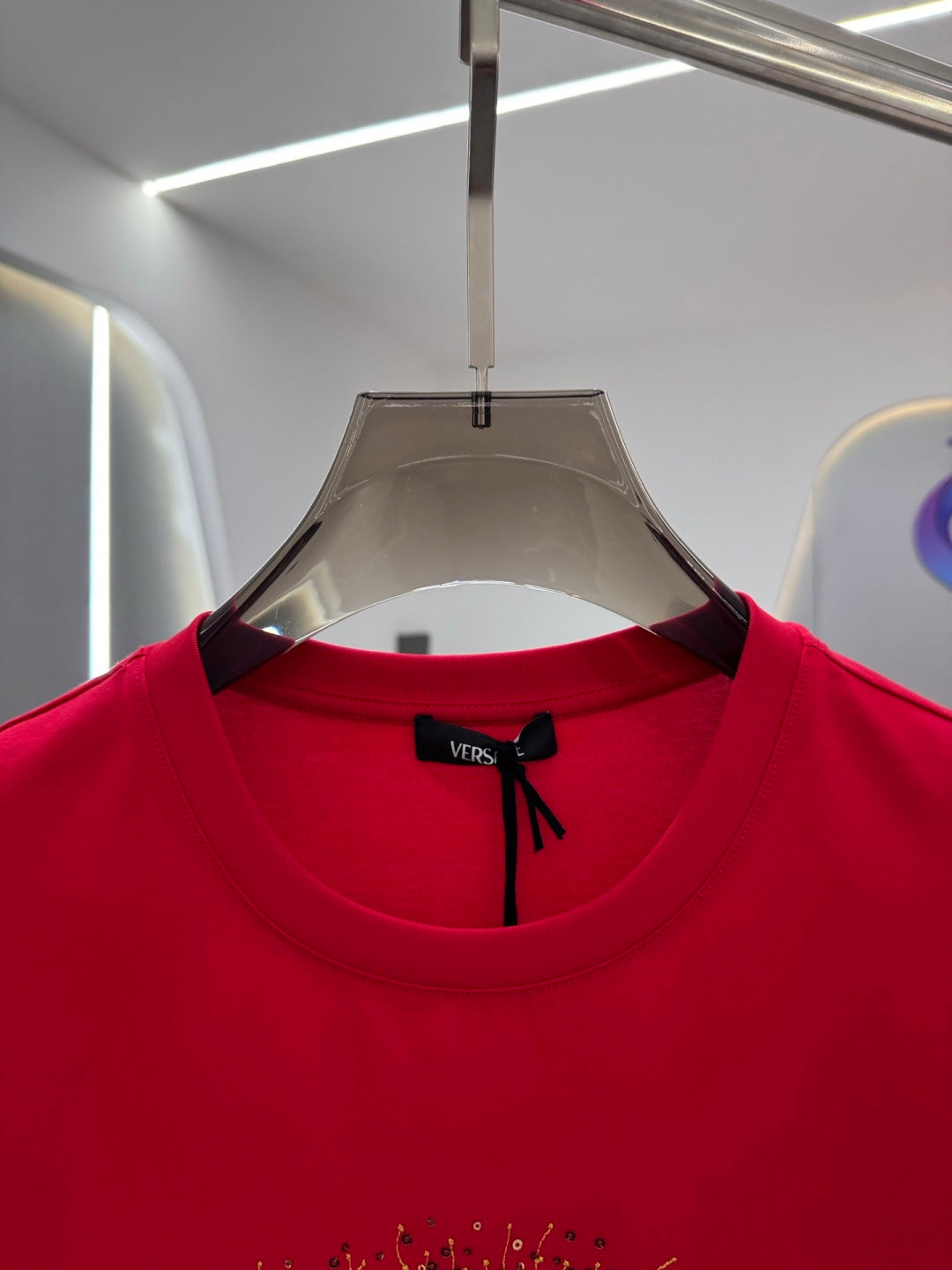 Versace red T-shirt neckline with black bow logo tag
