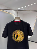 Versace T-shirt in dark navy with large gold circular emblem on front