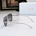 Dior sunglasses side view with silver frame and dark tinted lenses
