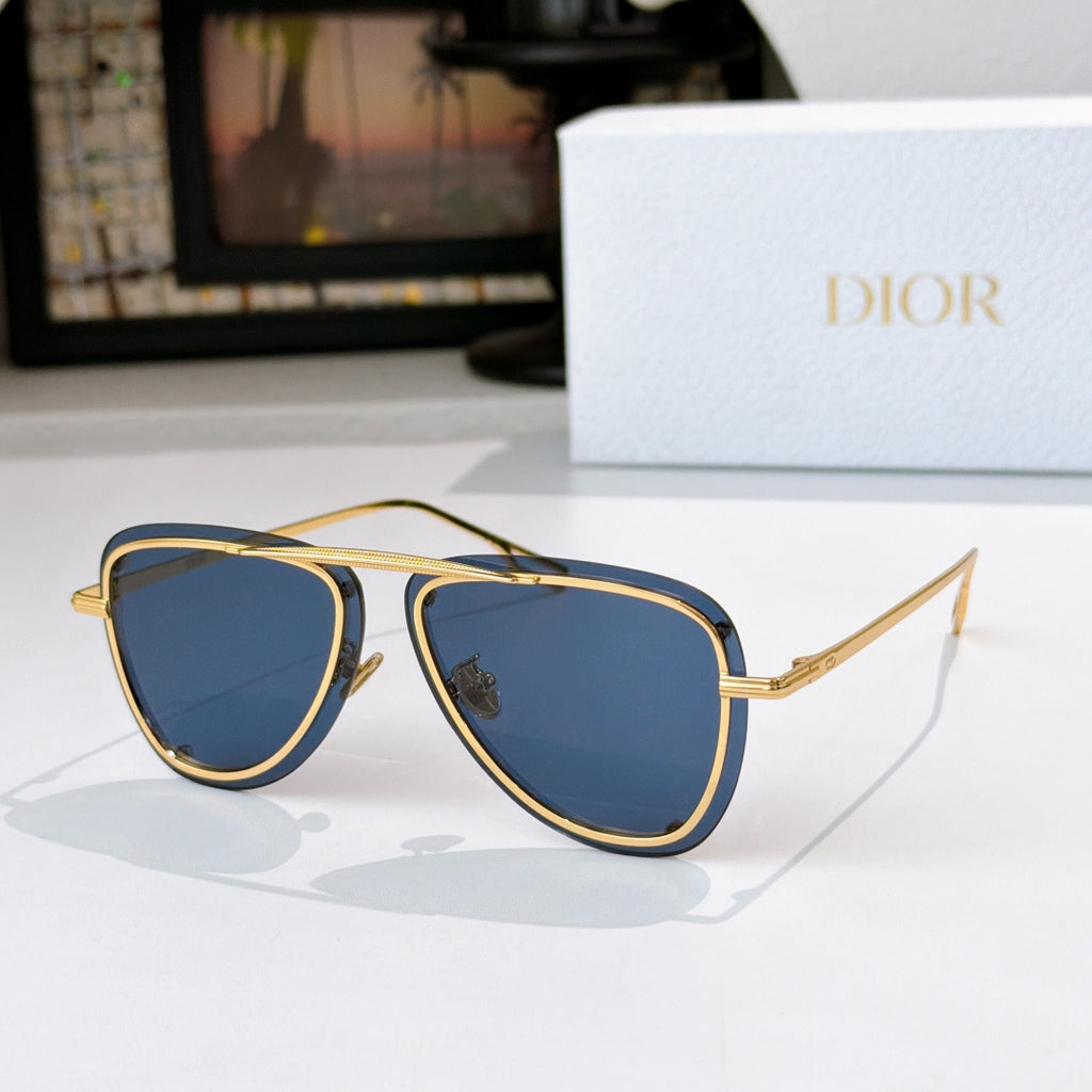Dior sunglasses with gold frame and blue tinted lenses, cat-eye silhouette