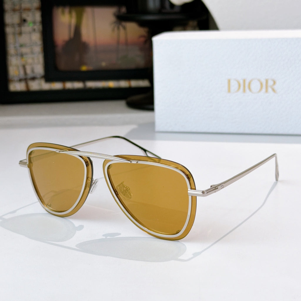 Dior sunglasses with gold frame and amber tinted lenses, cat-eye shape