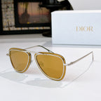 Dior sunglasses with gold frame and amber tinted lenses, cat-eye shape