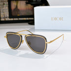Dior sunglasses with gold-trim frame and dark gray tinted lenses, cat-eye