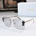 Dior oversized square sunglasses with clear lenses and dark flower embellishments