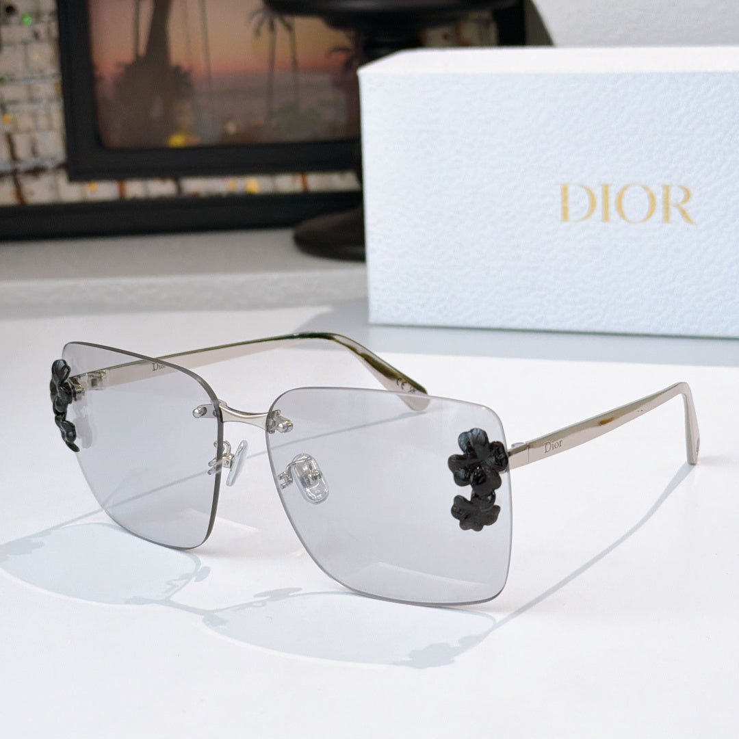 Dior oversized square sunglasses with clear lenses and dark flower embellishments