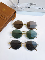 Assorted gold round sunglasses with dark, green, and blue-tinted lenses