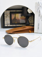 Gold round sunglasses with dark lenses and thin metal temples