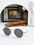 Round gold-frame sunglasses with dark gray lenses and thin metal arms.