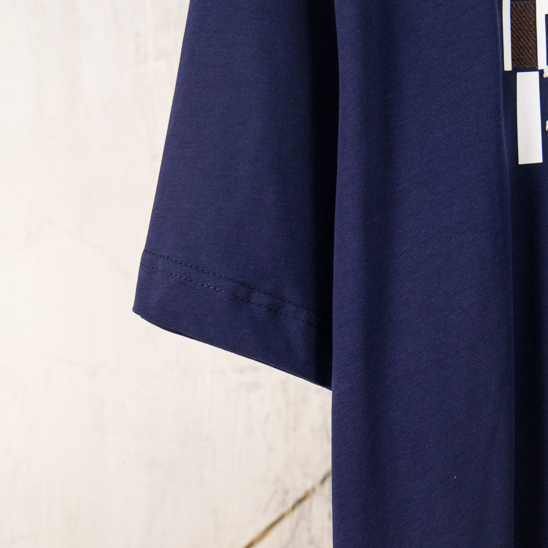 Fendi short-sleeve T-shirt side view showing drape and hem in dark navy