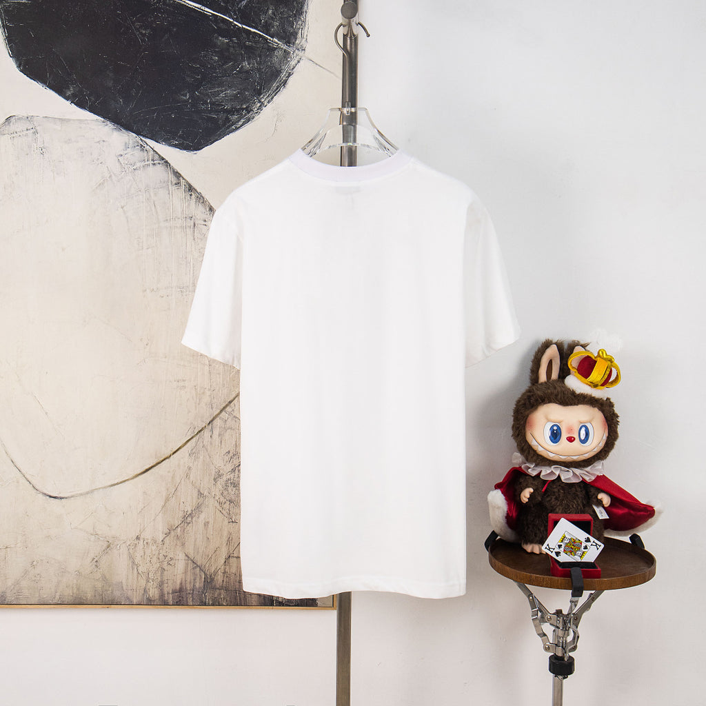 White Dior short-sleeve T-shirt on hanger with front patch graphic