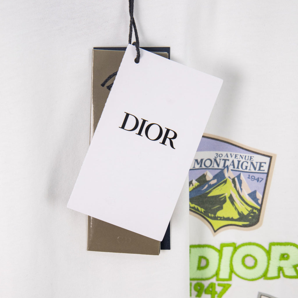 White Dior T-shirt with hanging tags and crest patch design