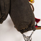 Jacket sleeve cuff with elastic gather and metal clip detail