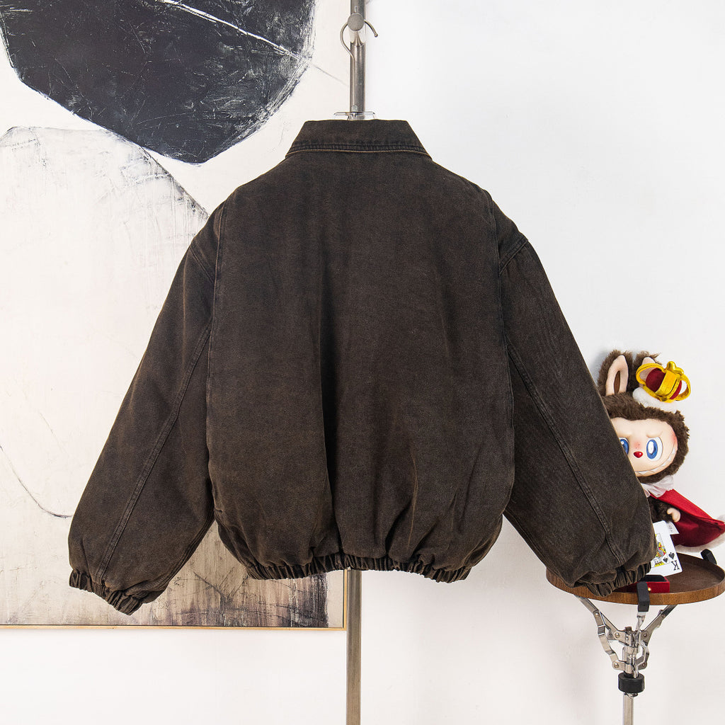 Prada dark denim jacket back view with gathered sleeves and elastic hem