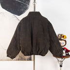 Prada dark denim jacket back view with gathered sleeves and elastic hem