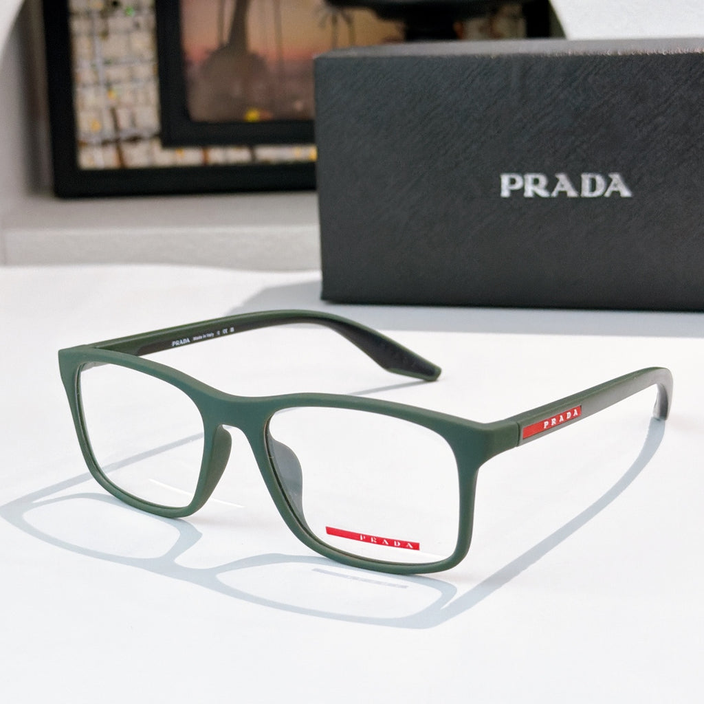Prada glasses with green rectangular frames, clear lenses, PRADA logo on temples