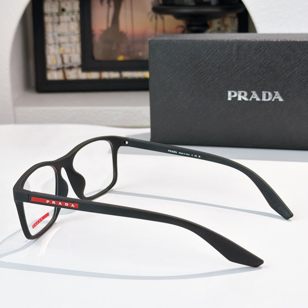 Prada glasses angled view with black rectangular frames and PRADA logo on temple