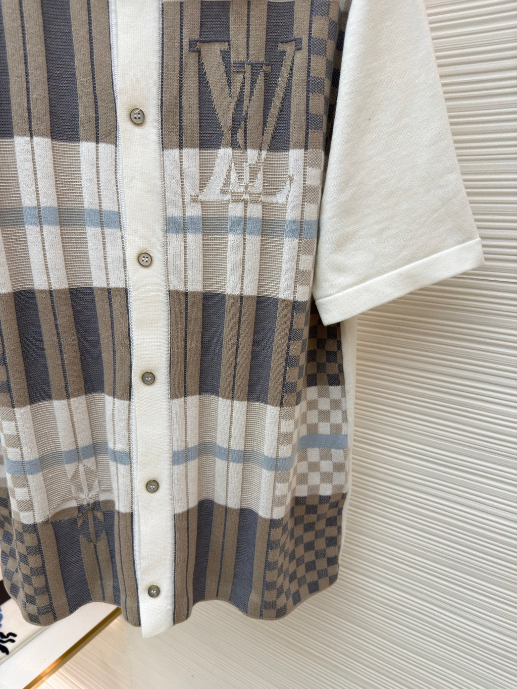 Louis Vuitton short-sleeve button-up shirt detail, plaid panel with monogram print