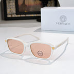 Versace sunglasses with white frame and pink tinted lenses, gold temple accents