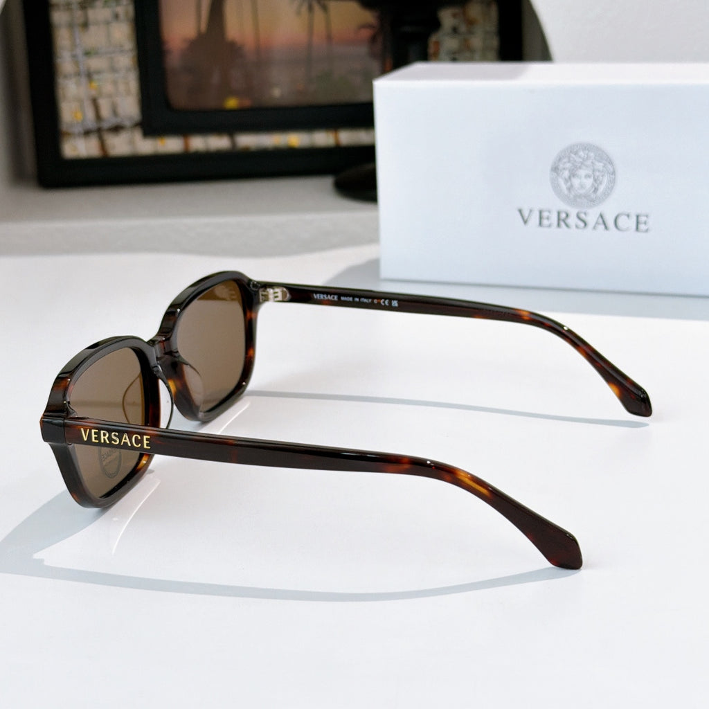 Versace sunglasses with tortoiseshell frame and brown lenses, side view
