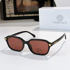 Versace sunglasses with black frame and brown tinted lenses, gold temple accents
