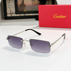 Cartier sunglasses with dark purple lenses and gold-tone metal frame