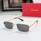 Cartier sunglasses with smoky gray lenses and gold-tone metal frame