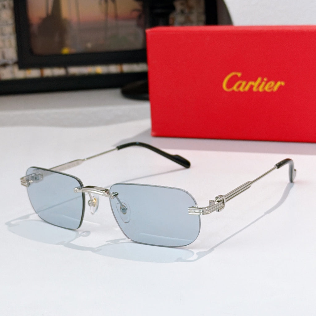 Gold-rimmed sunglasses with light blue lenses and black arms, metal hinges
