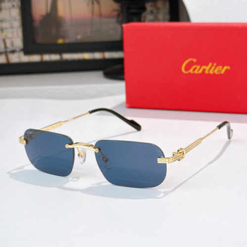 Gold-rimmed sunglasses with dark blue lenses and black arms, metal hinges