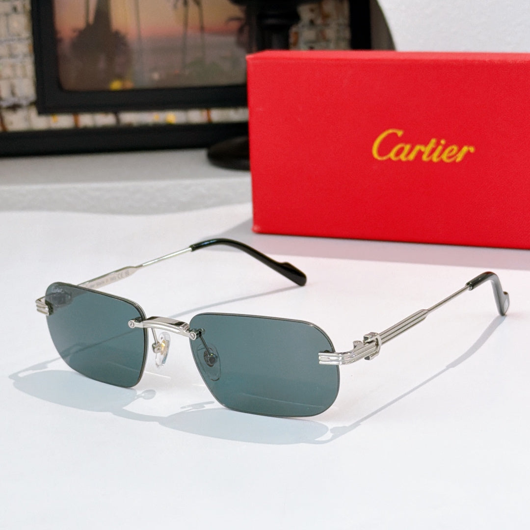 Gold-rimmed sunglasses with teal blue lenses and black arms, metal hinges