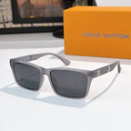 Dark square-frame sunglasses with black lenses and gold logo on temple