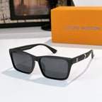 Black square-frame sunglasses with dark lenses and gold logo on temple