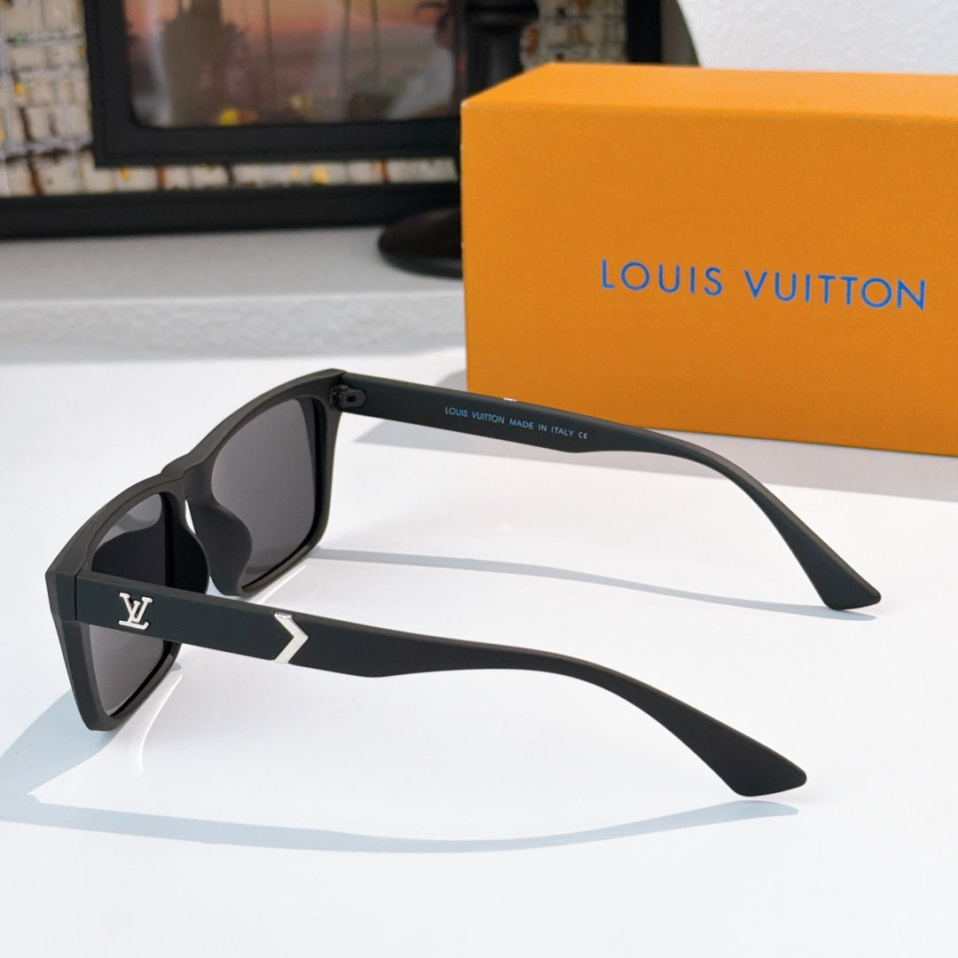 Black cat-eye style sunglasses with dark lenses and gold logo on temple